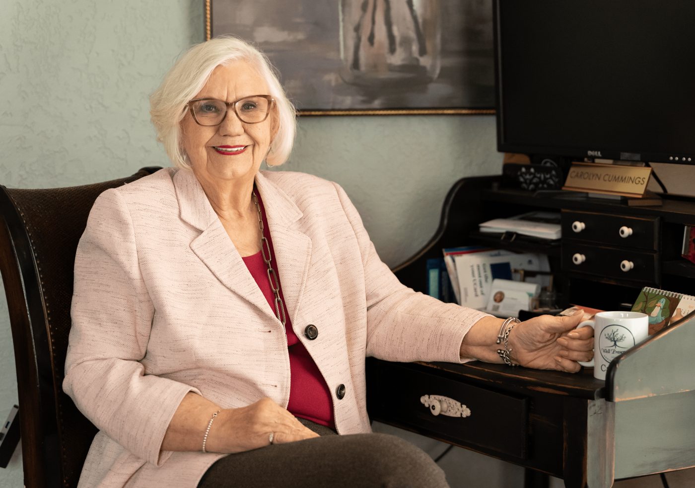 Carolyn Cummings at her desk in the Well Preserved office